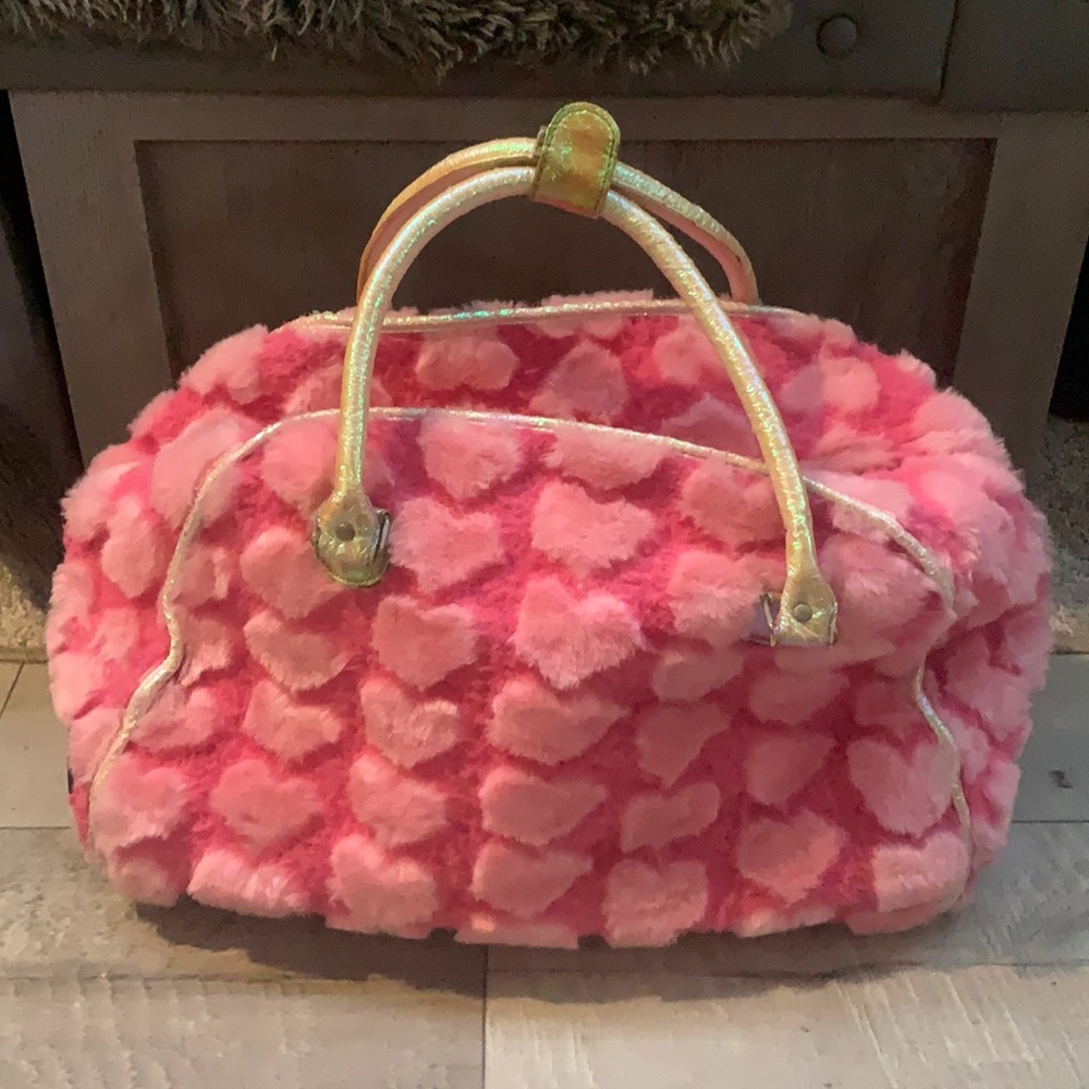 RARE Justice rolling luggage